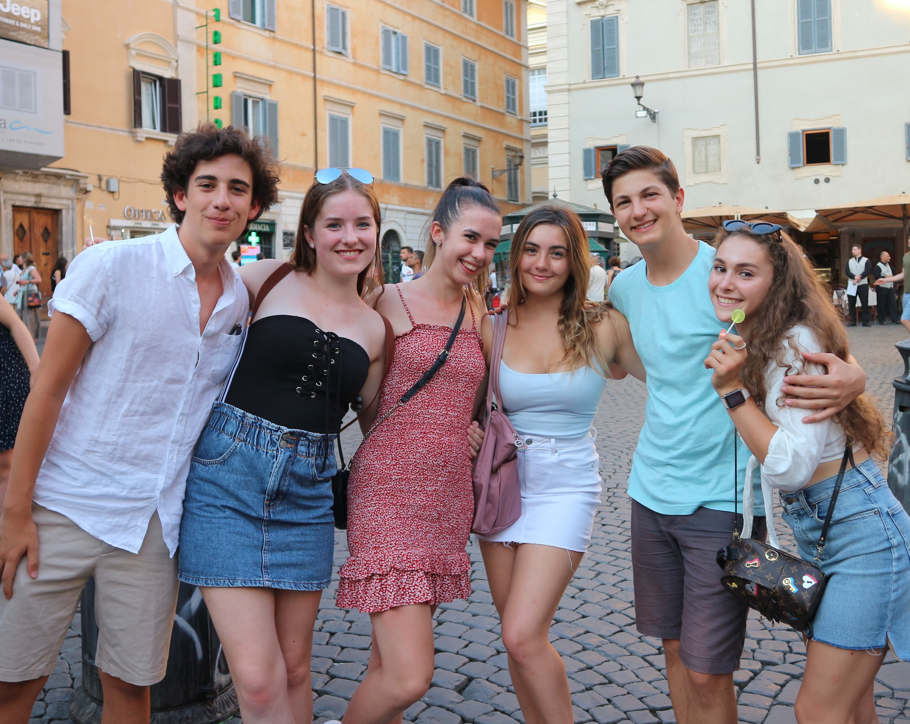 High school students posing for a photo in a piazza in Rome, Italy